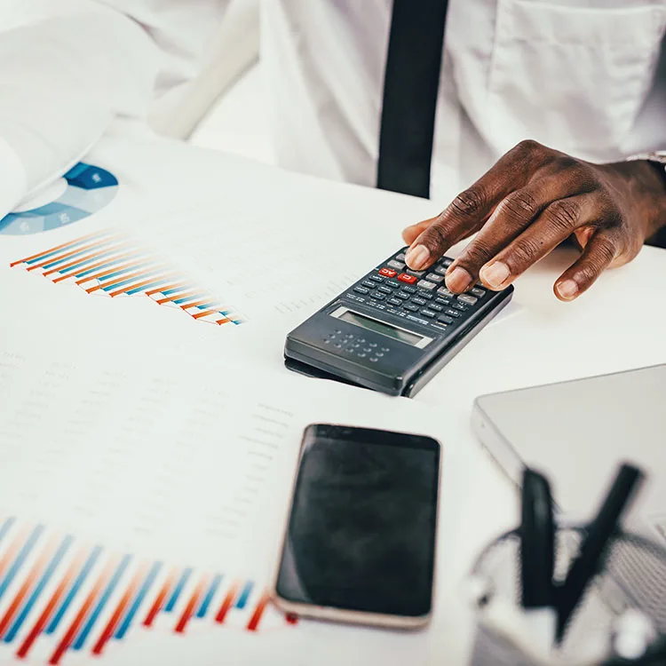 Working through financial reports with a calculator