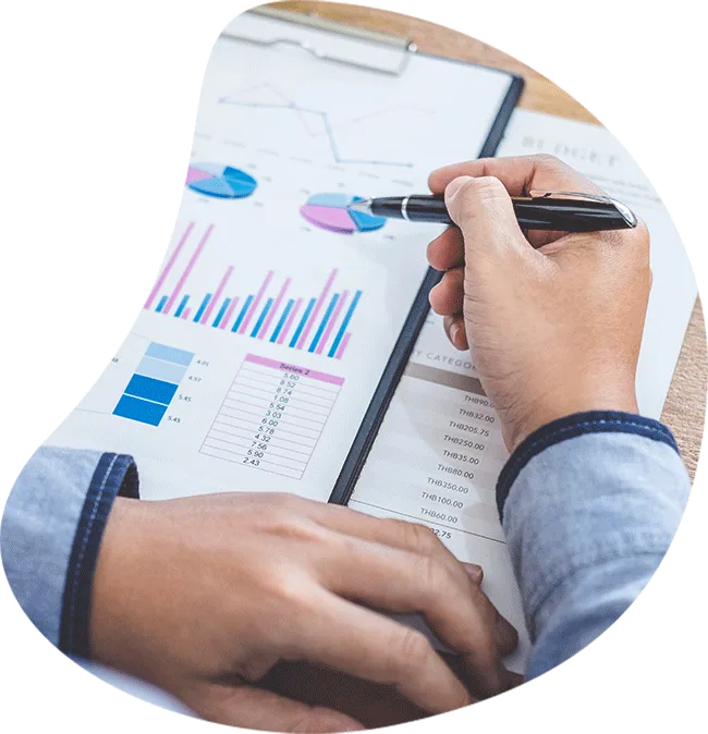 Reviewing a budget report with charts on a clipboard